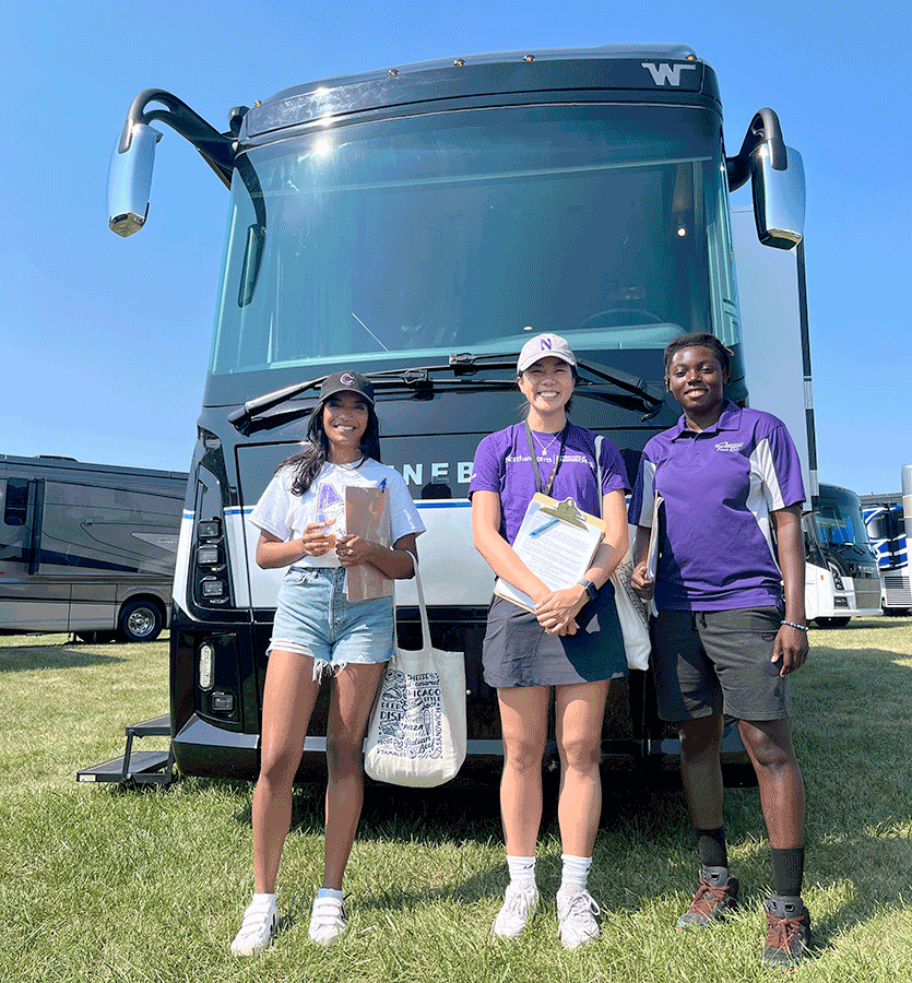 Segal students Sarah John, Quynh-Nhi Tran, and Godsgift Chukwudi at the Winnebago Grand National Rally.